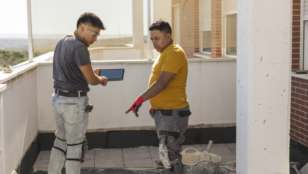 The current image has no alternative text. The file name is: worker-on-the-terrace-putting-asphalt-cloth-they-2026-03-19-02-14-10-utc-scaled.jpg